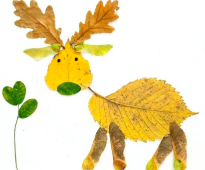A deer made out of yellow, brown and green leaves