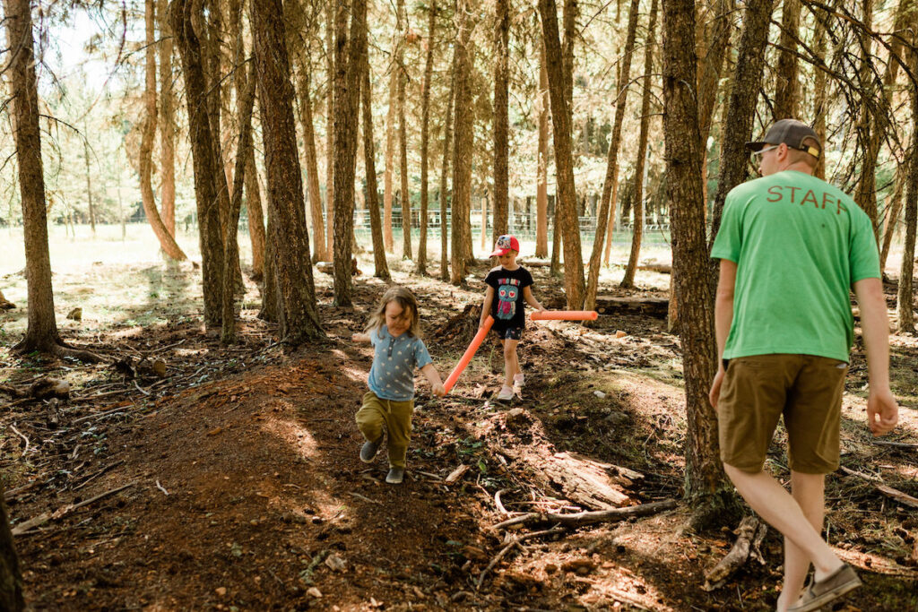 Kids running in the forest and having fun with Wild & Immersive team member
